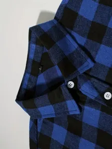 Detailed closeup of men's blue and black plaid flannel shirt collar with buttons and size L tag.