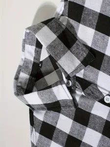 Men's black and white flannel plaid shirt collar and cuff detail, casual long sleeve top.