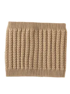 Close-up detail of warm knitted cable neck warmer, soft wool fleece texture for cold winter days.
