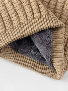 Detailed close-up showing the soft fleece lining and knitted texture of the neck warmer.