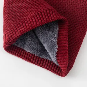 Close up detail view of dark red knitted neck warmer with cozy grey fleece lining.