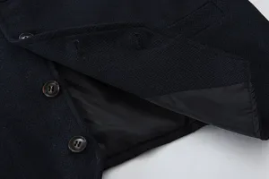 Men's suit vest detail, navy herringbone fabric, buttons, smooth inner lining close up.
