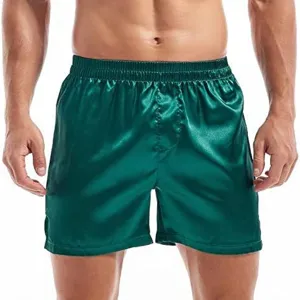Green satin men lounge shorts detail view, smooth fabric underwear trunk style elastic waist.