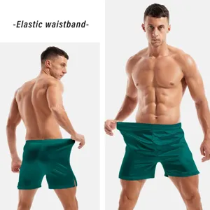Detailed view of men's green satin boxer shorts featuring a comfortable elastic waistband.