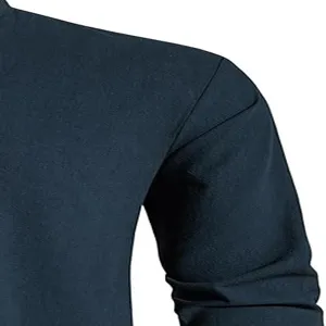 Dark blue men's long sleeve shirt shoulder detail view showing fabric texture and fine stitching.