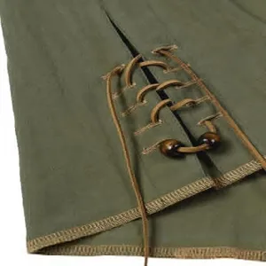 Detail view of men's vintage green long sleeve shirt featuring brown leather lacing and wood beads.
