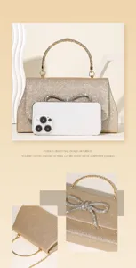 Glitter evening handbag with rhinestone bow, elegant gold handle for parties and dinners.