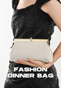 Detailed view of elegant women evening clutch bag with rhinestone lock and metallic frame.