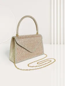 Exquisite rhinestone evening bag detail, sparkling crystals and gold chain strap showcase luxury.