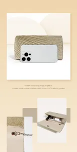 Detailed view of pleated glitter evening clutch showing size comparison and inner structure.