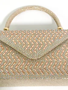 Sparkling rhinestone evening bag detail, luxurious crystal embellished clutch surface texture.