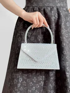Sparkling rhinestone evening bag with elegant handle, perfect for weddings and parties.