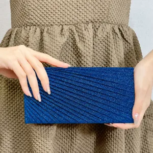Blue glitter pleated evening clutch bag, elegant mini handbag for parties and wedding events.