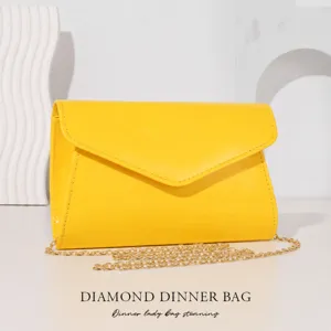 Yellow patent leather envelope evening clutch bag with golden chain for women parties.