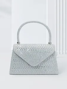 Silver rhinestone evening bag with sparkling crystals and elegant round handle for parties.