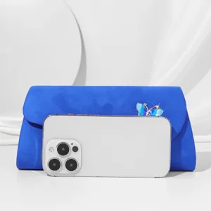 Elegant blue suede evening clutch bag with sparkling rhinestone butterfly detail for women.