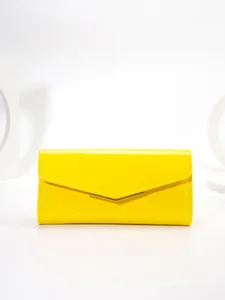Bright yellow patent leather envelope clutch bag detail showing metal V-bar closure design.