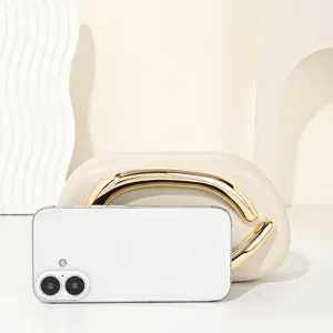 Elegant beige evening dinner bag featuring a luxury gold metal handle for women parties.
