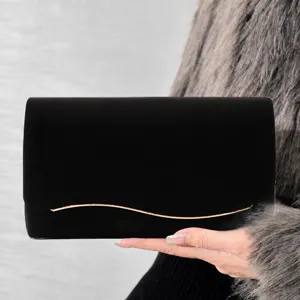 Black velvet evening handbag with elegant gold wave metal decor, perfect for wedding party.