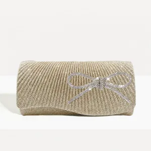 Gold pleated evening clutch bag with sparkling rhinestone bow for party and wedding events.