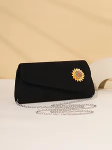 Elegant black evening clutch bag featuring a stunning rhinestone sunflower brooch and chain.