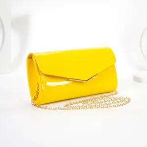 Yellow patent leather envelope clutch bag for women, elegant evening shoulder bag with chain.