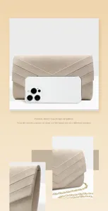 Detailed view of chic suede evening clutch bag with V-stripes design and practical size reference.
