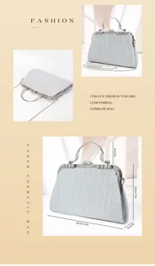 Detail view of a sparkling silver evening clutch bag with rhinestone frame and chain strap.