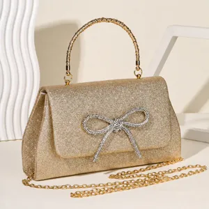 Gold glitter evening handbag with rhinestone bow, metal handle and chain for women party.