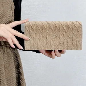 Exquisite gold glitter diamond pattern evening bag, stylish mini clutch for women's party.