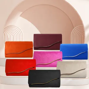 Elegant suede evening clutch bag for women, chic envelope design with metal wave trim for party.