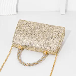 Gold sequin evening handbag with dazzling rhinestone twisted handle and chic chain strap.