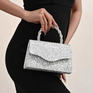 Elegant silver sequin evening handbag with sparkling rhinestone twisted top handle for women.