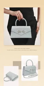 Silver glitter evening bag with rhinestone bow detail, elegant handbag and crossbody chain.