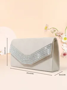 Detailed view of elegant velvet evening clutch with sparkling crystal rhinestone flap design.