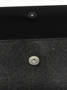 Black glitter evening clutch bag interior metal magnetic snap button close-up detail