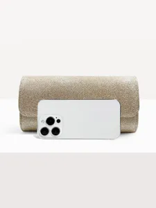 Gold sparkly evening clutch bag detail showing delicate glitter texture and compact size for parties.
