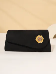 Black evening clutch bag featuring a stunning rhinestone sunflower brooch detail for women.