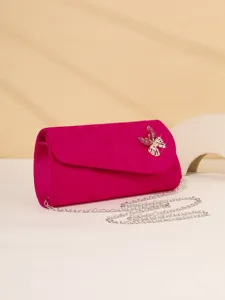 Stunning fuchsia velvet evening clutch bag featuring a dazzling crystal butterfly and silver chain.