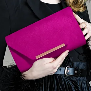 Fuchsia velvet evening clutch bag for women, elegant party handbag with metal bar clasp.
