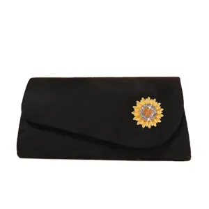 Elegant black evening clutch bag featuring a dazzling rhinestone sunflower brooch for women.