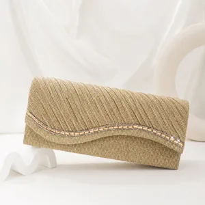 Elegant gold glitter pleated evening clutch bag with sparkling rhinestone wave detail for party.