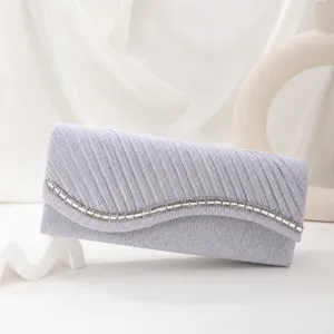 Elegant pleated rhinestone evening clutch bag for women, stylish silver sparkly party handbag.