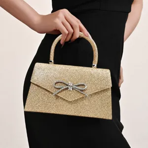 Gold glitter evening handbag with rhinestone bow, elegant party wedding clutch bag
