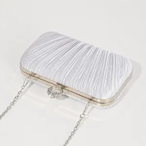 Silver pleated evening clutch bag with rhinestone ring clasp and chain strap for women party.