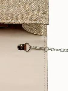 Exquisite glitter evening clutch detail showcasing shiny texture and metal chain.