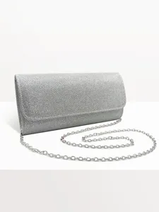 Silver glitter evening clutch detail, metal chain strap close-up, elegant wedding party purse.