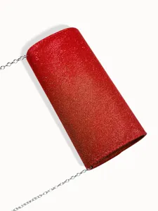 Sparkling red evening clutch bag detail, elegant fine glitter finish with silver chain strap.
