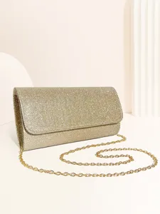 Gold glitter evening clutch bag detail shot featuring an elegant metallic chain strap.