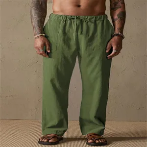 Men linen casual trousers detail view, solid green color, drawstring waist, comfortable fit.